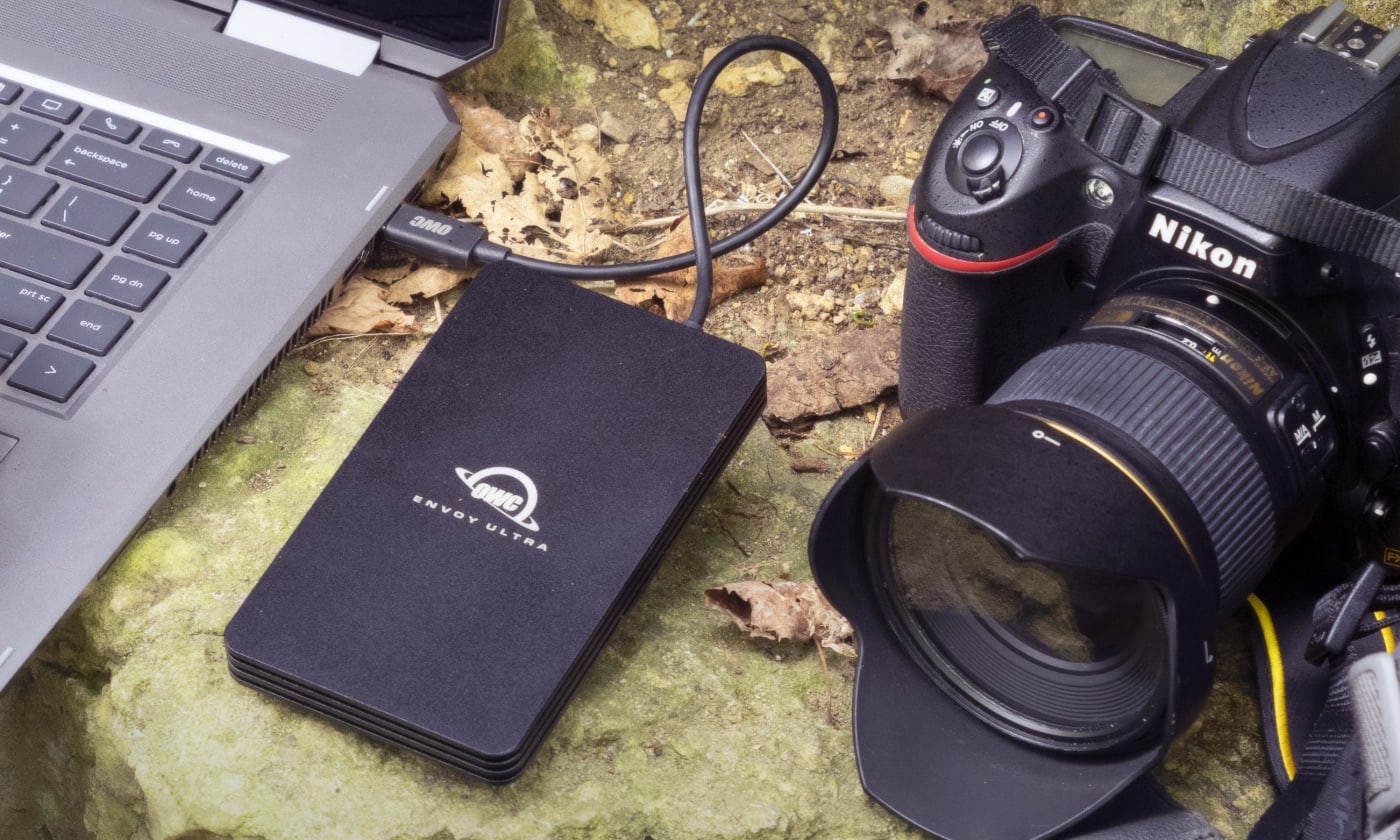 OWC Envoy Ultra being used for editing on a rocky outdoor surface