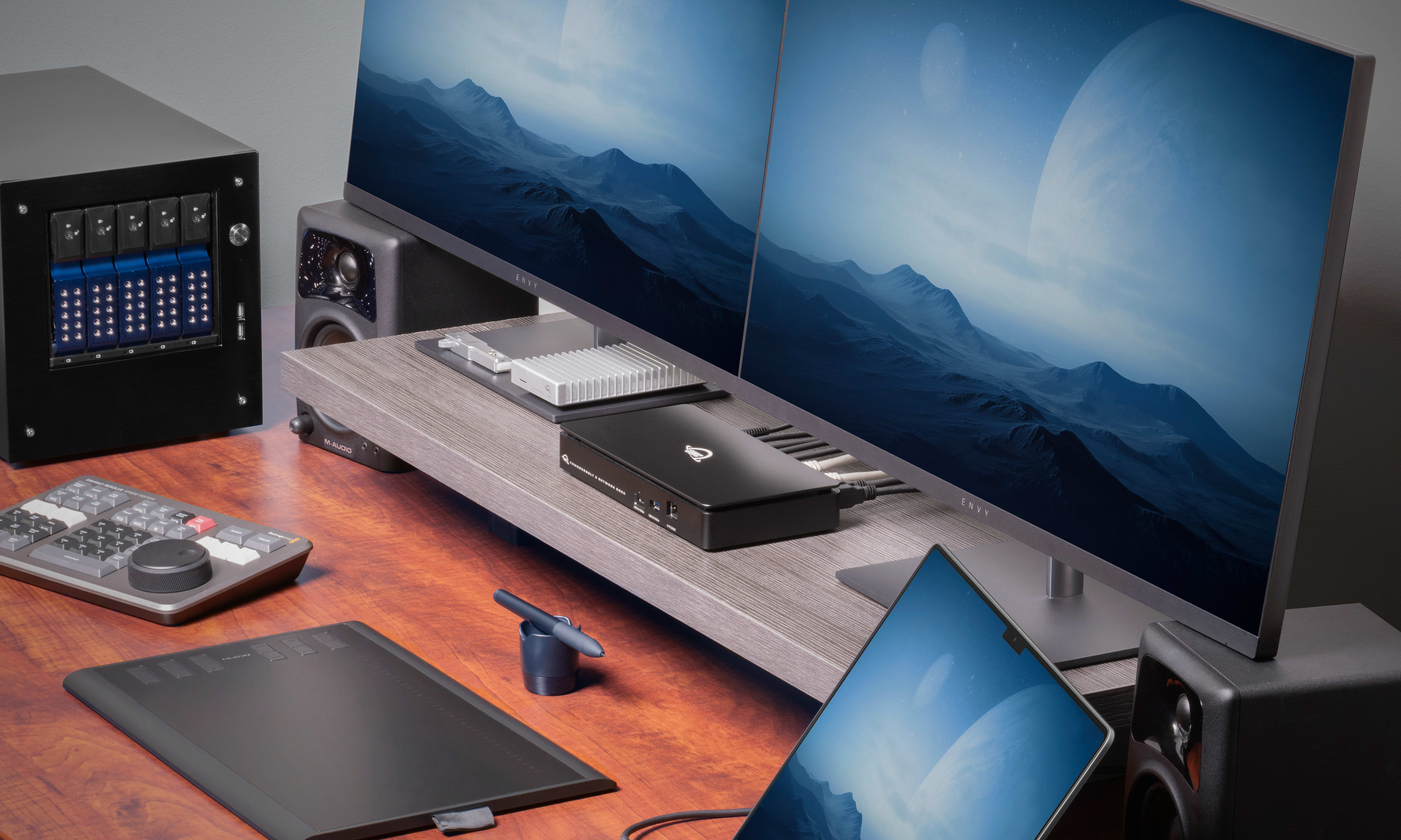 OWC Thunderbolt 5 Dual 10GbE Network Dock on a desk, setup with multiple devices connected