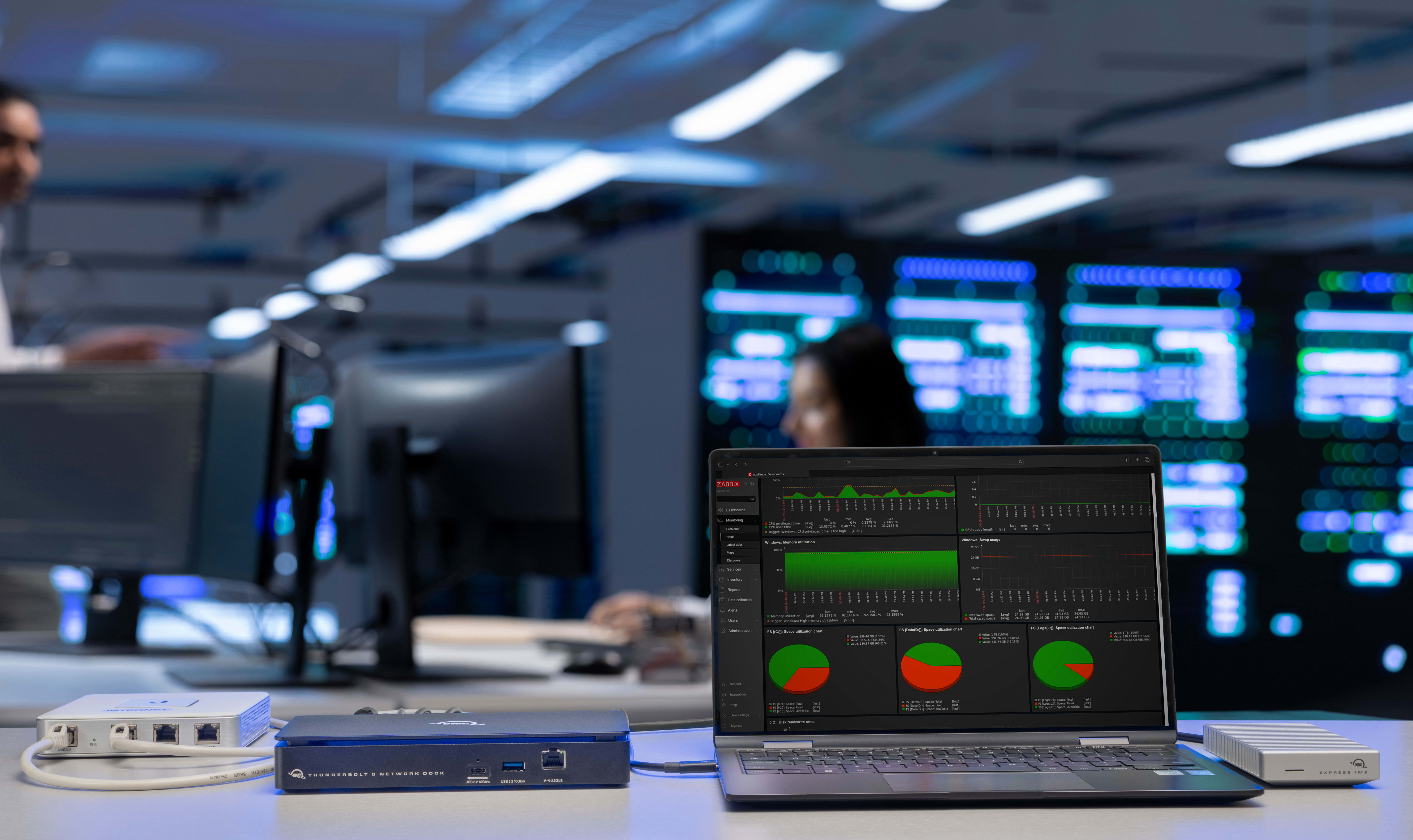 OWC Thunderbolt 5 Dual 10GbE Network Dock being used In a server room while having a Express 1M2 80G connected