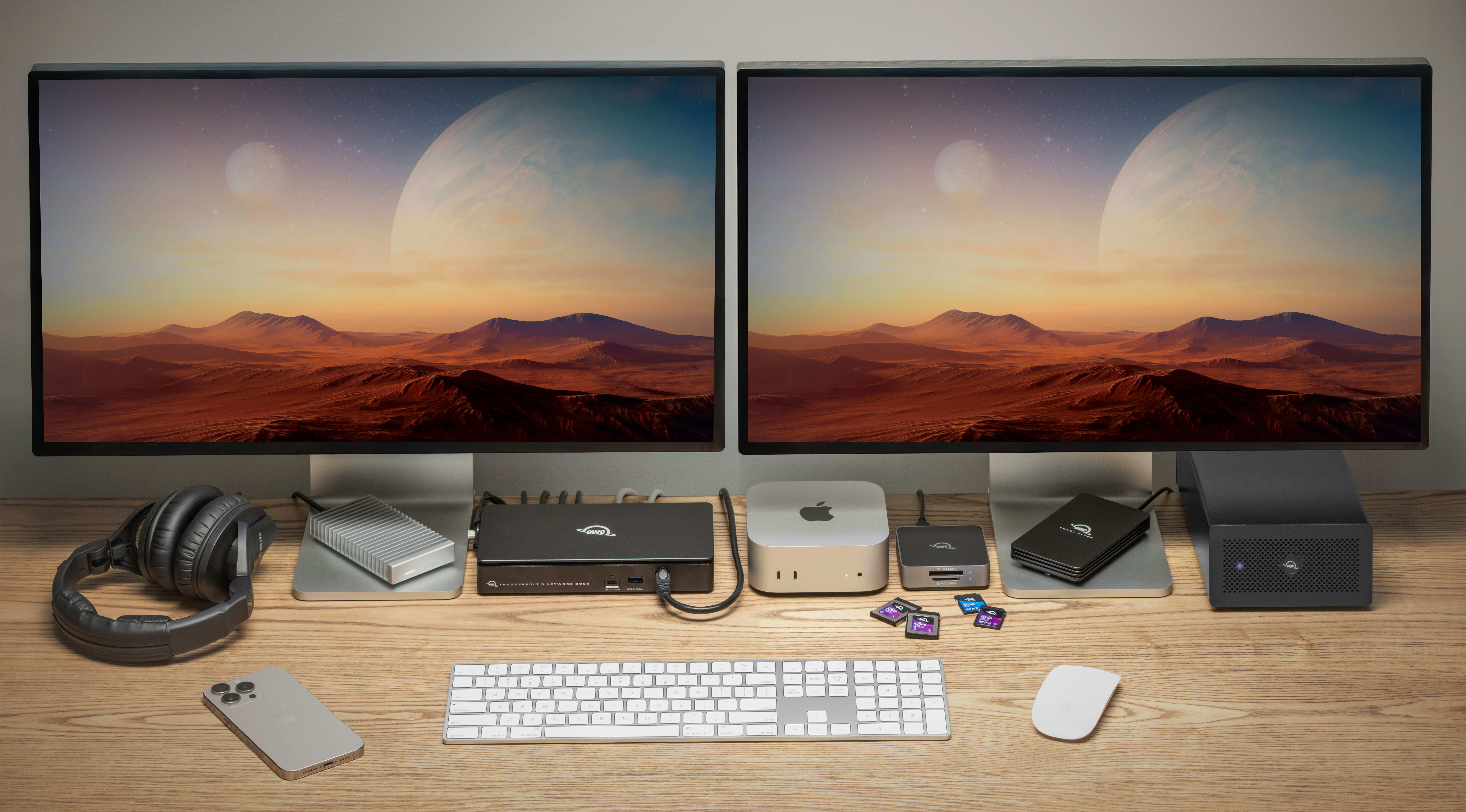 OWC Thunderbolt 5 Dual 10GbE Network Dock on a desk connected to multiple devices