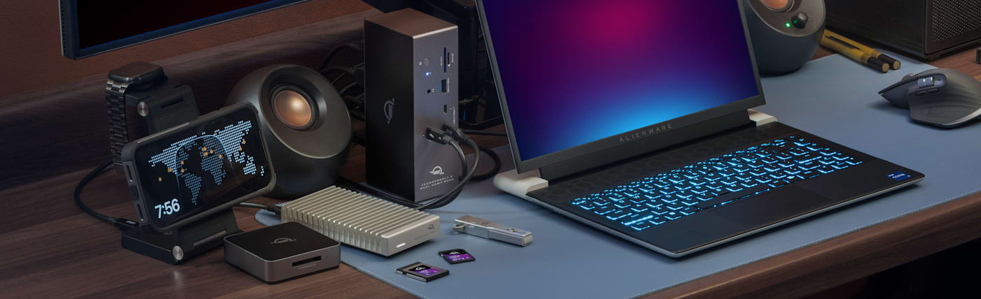 OWC Thunderbolt 5 Dock with Dual HDMI on desktop with PC laptop