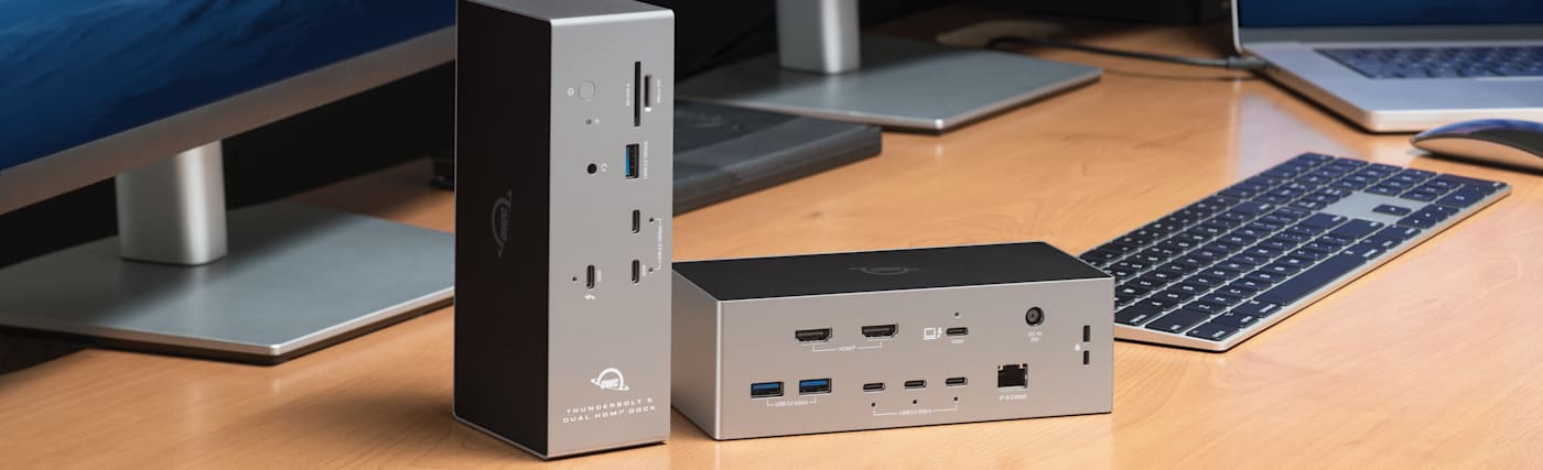 Two OWC Thunderbolt 5 Docks with Dual HDMI sitting on desk showing vertical and horizontal positions