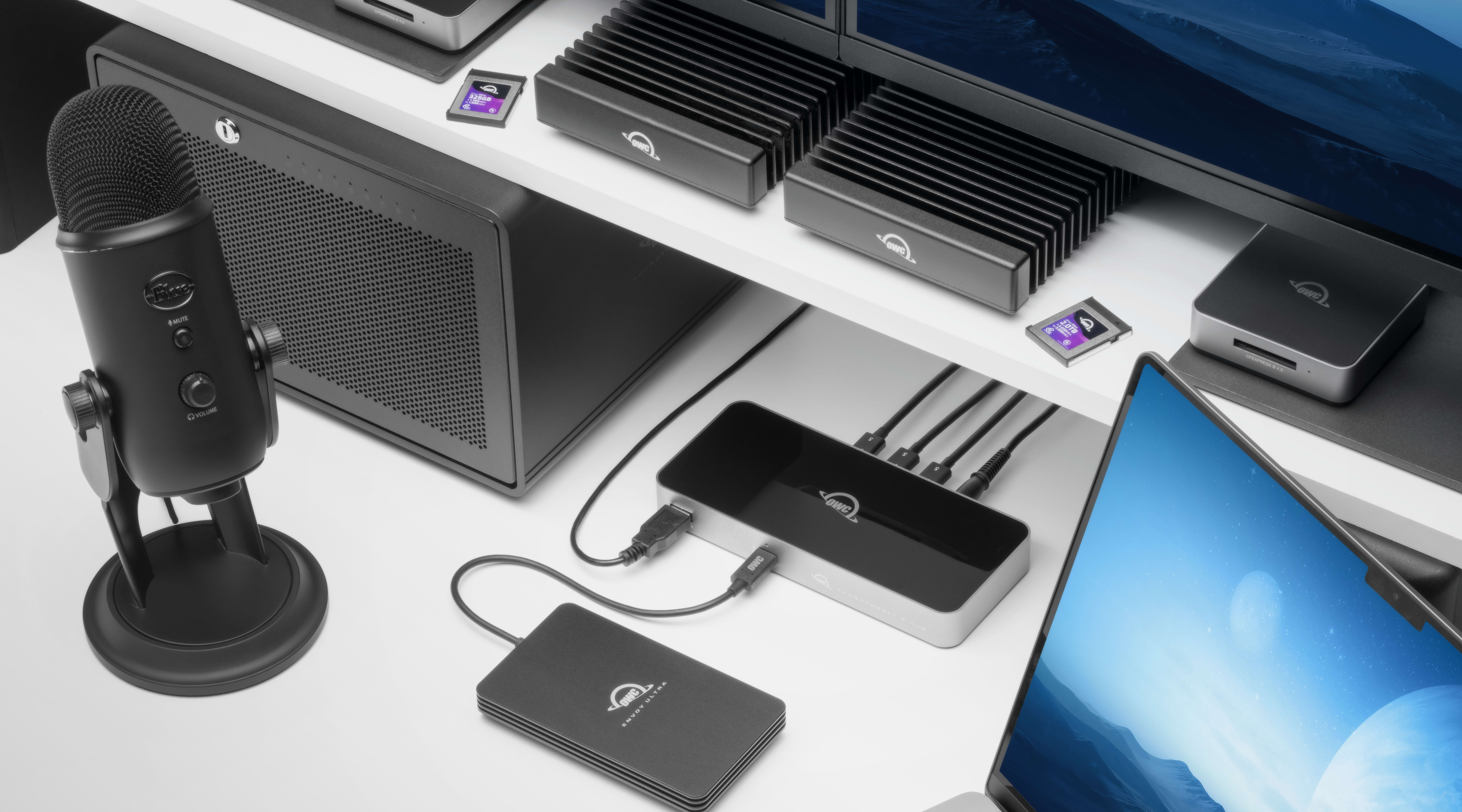 OWC Thunderbolt 5 Hub connected to two OWC ThunderBlades and a MacBook Pro