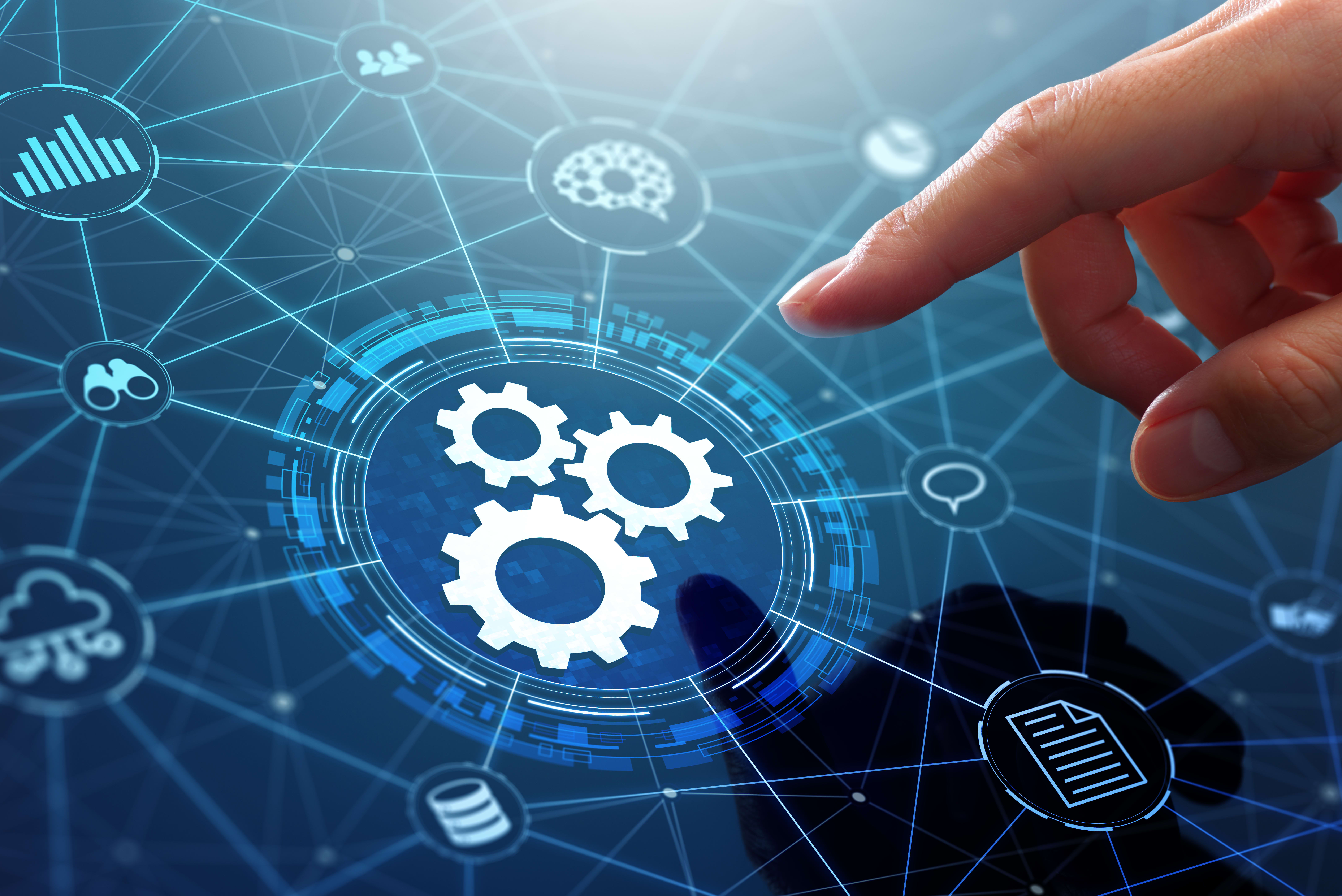 A hand reaching out to select a digital gear icon that is connected to a web of other icons that represent cloud services, documents, intelligence, and other data sources