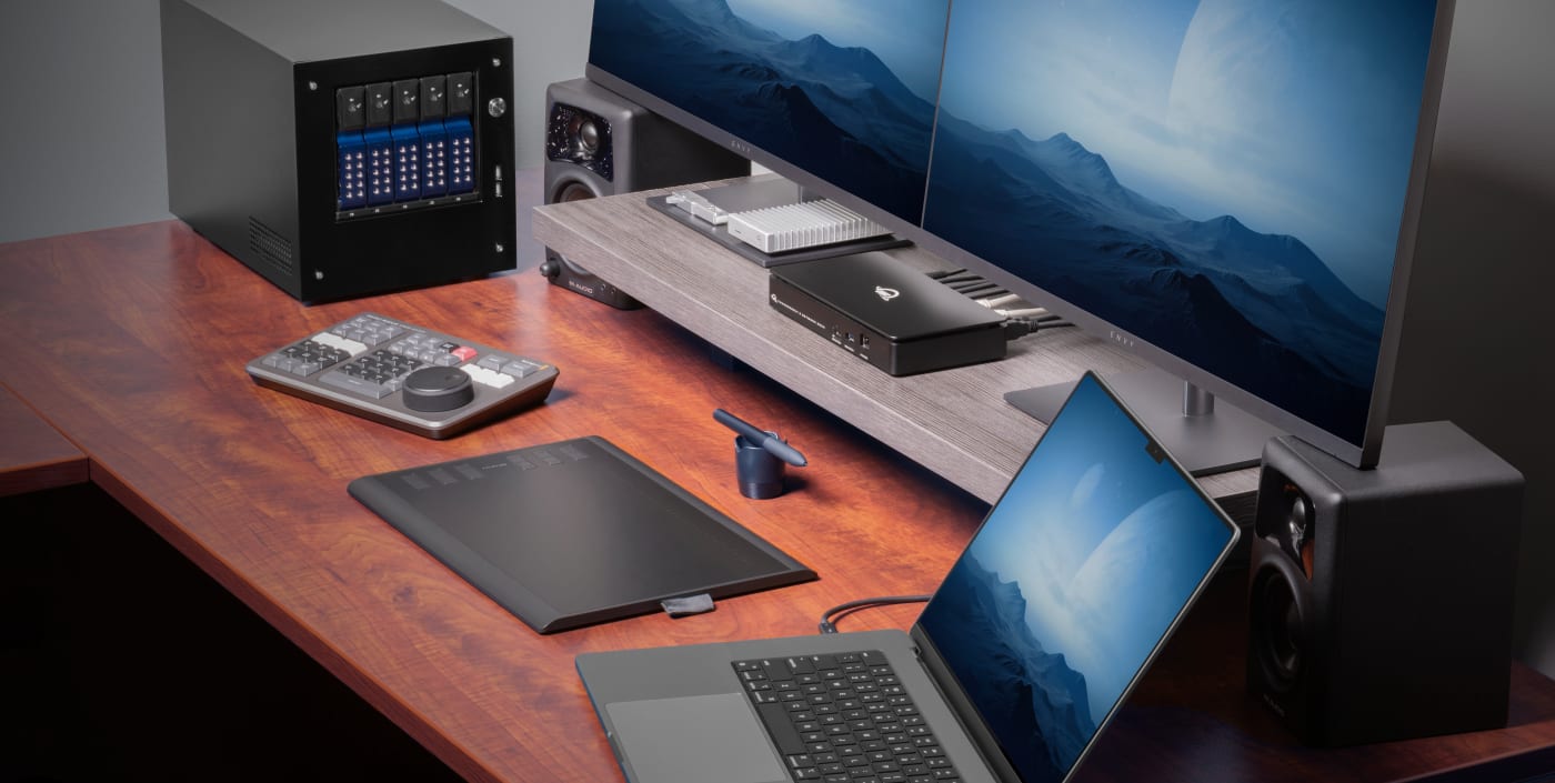 Thunderbolt 5 Dual 10GbE Network Dock on a desk, setup with multiple devices connected to it