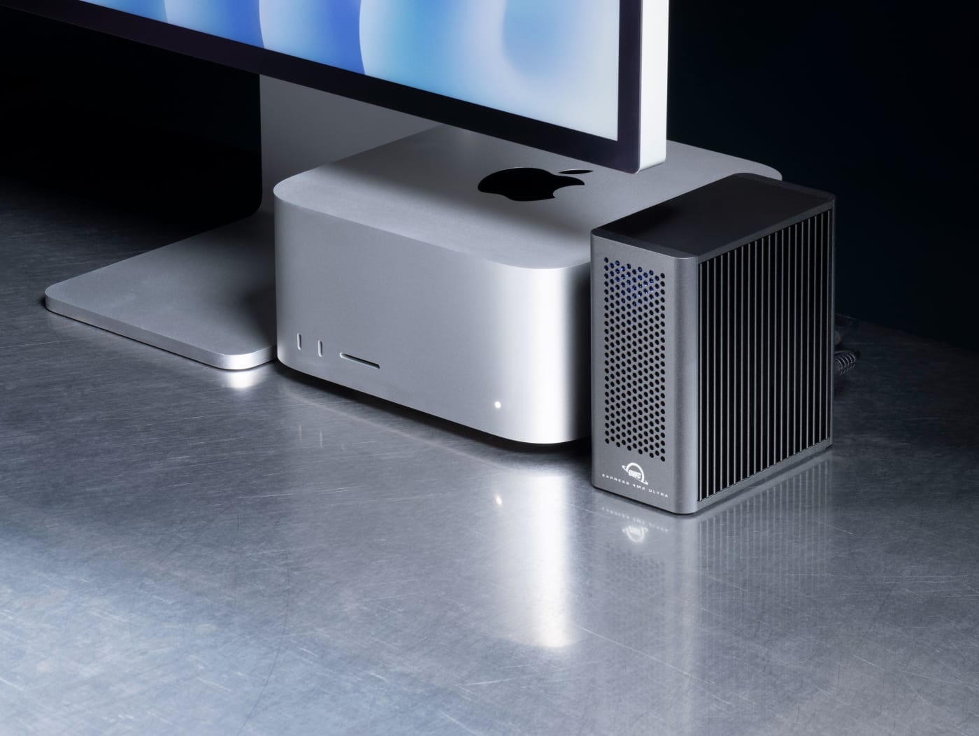 OWC Express 4M2 Ultra on desktop next to Mac Studio