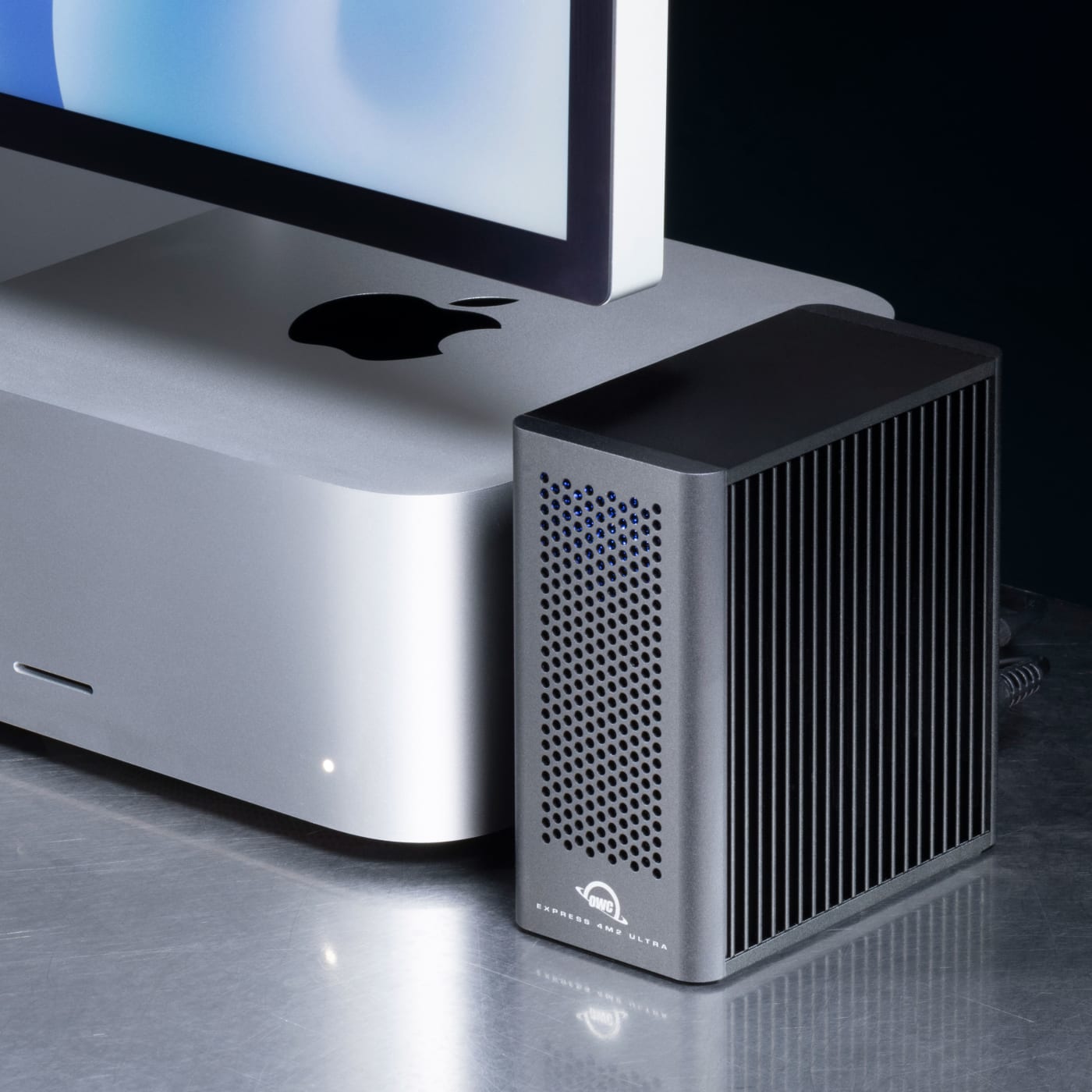 OWC Express 4M2 Ultra on desktop next to Mac Studio