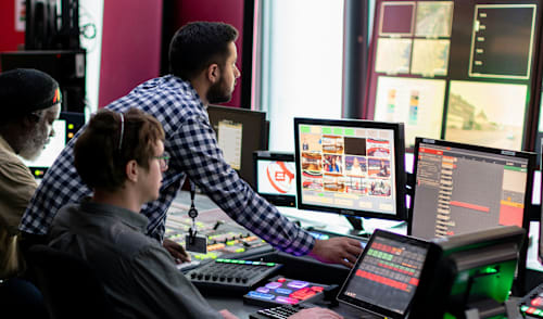 Three professionals operating a video and audio stream