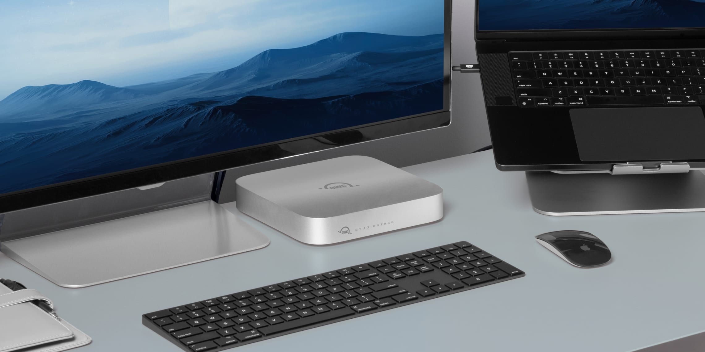 OWC StudioStack on desktop with MacBook Pro, keyboard, mouse and display