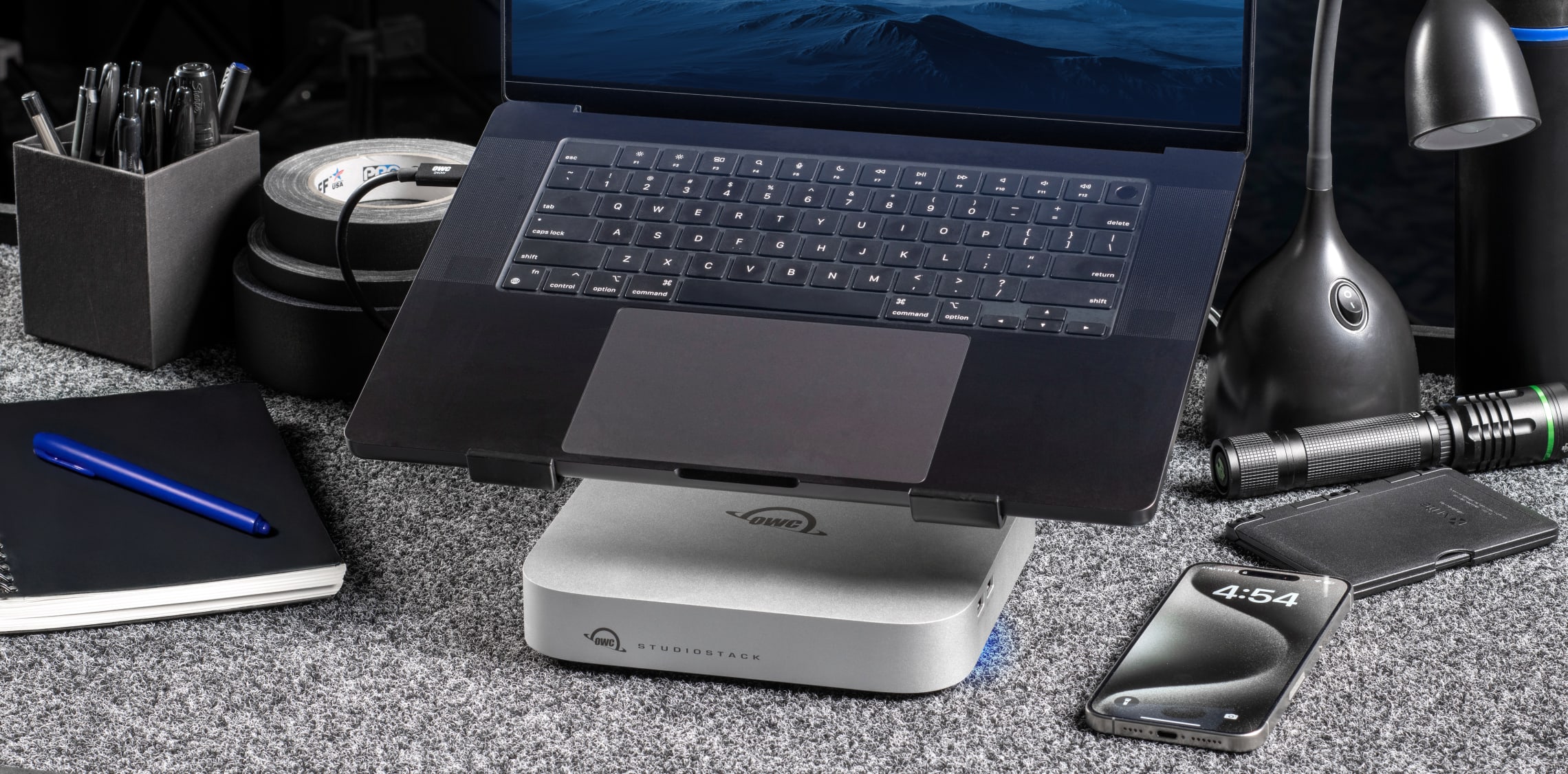 OWC StudioStack on desktop under a MacBook Pro on desktop stand