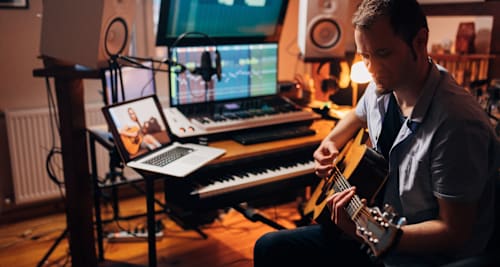 Guitarist in music studio