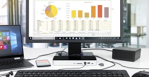 Straight on view of OWC 14-Port Thunderbolt Dock connected to laptop, monitor, and keyboard