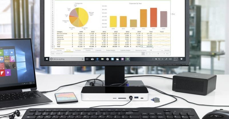 Straight on view of OWC 14-Port Thunderbolt Dock connected to laptop, monitor, and keyboard