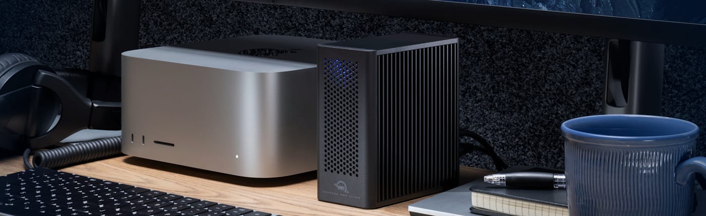 OWC Express 4M2 Ultra on desktop next to Mac Studio