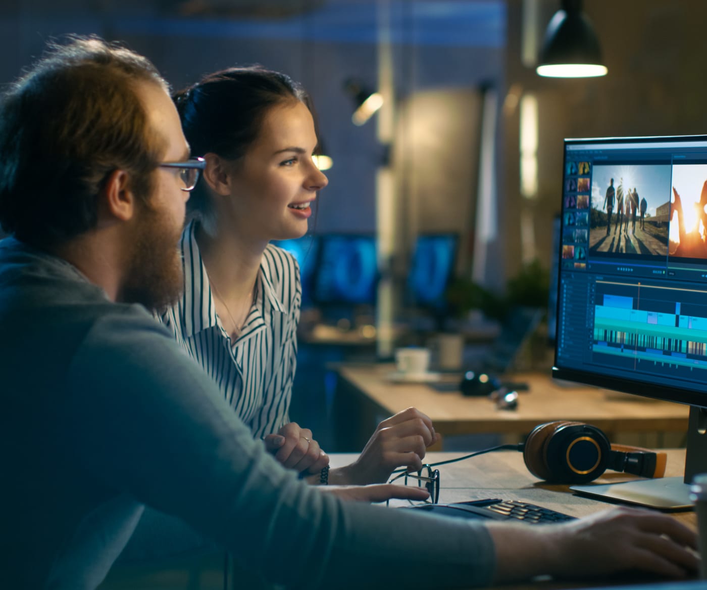 Video editors working at desk