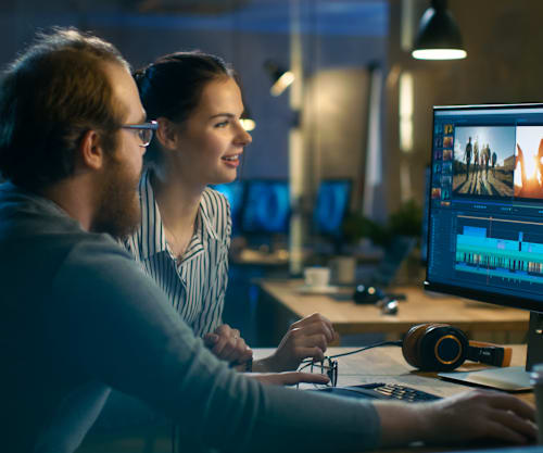 Video editors working at desk