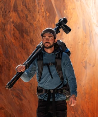 Photo of Forest Barkdoll, photographer carrying photography gear