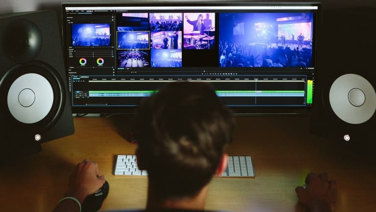 rear shot of man editing video