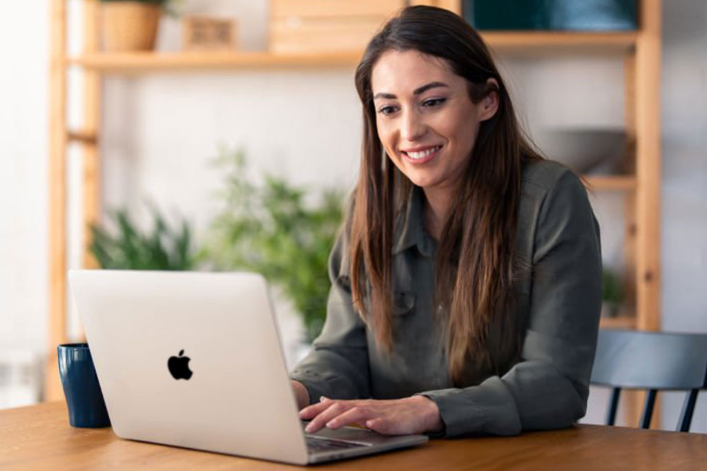 Woman registering her OWC product using a laptop