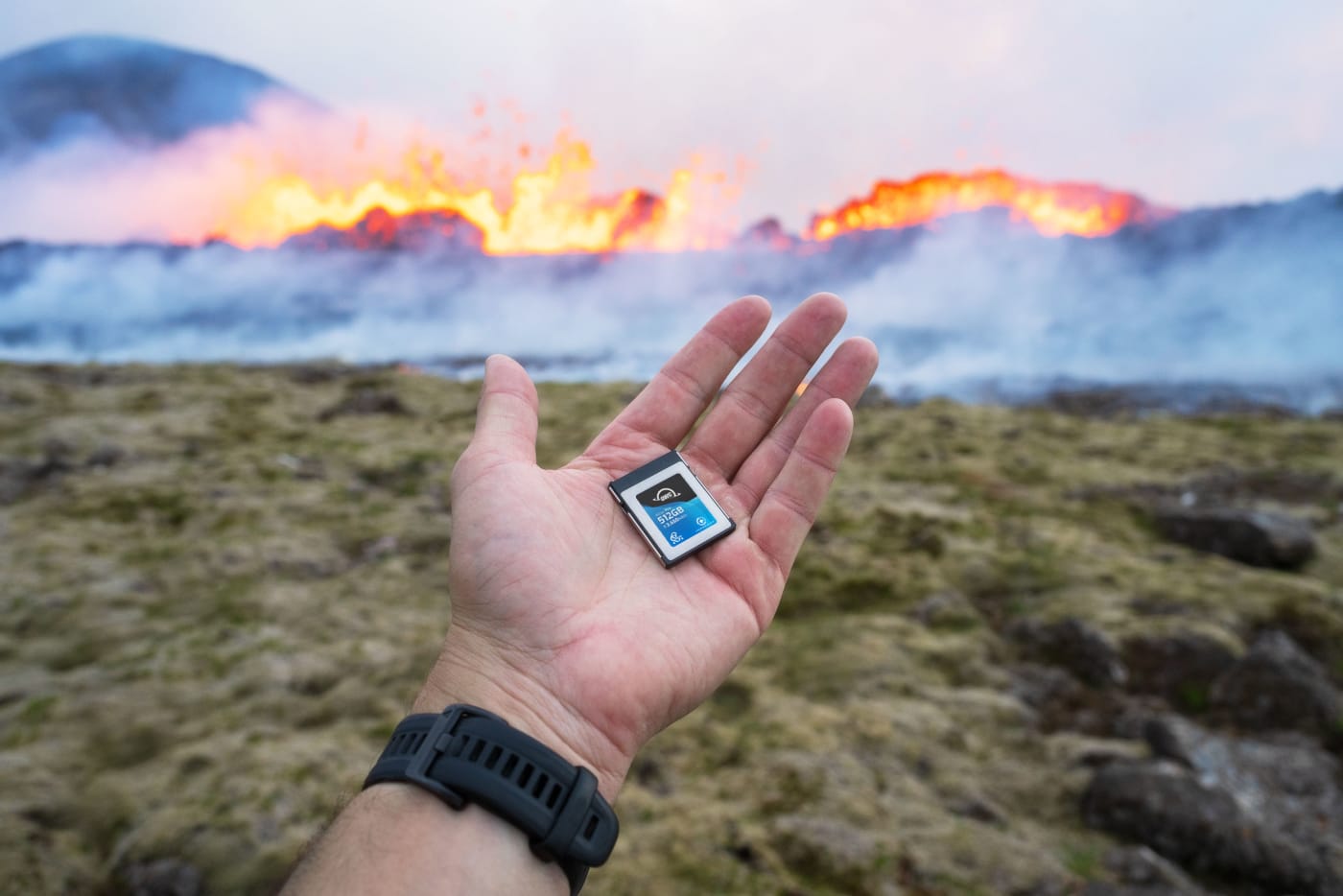 Photographer holding card in hand