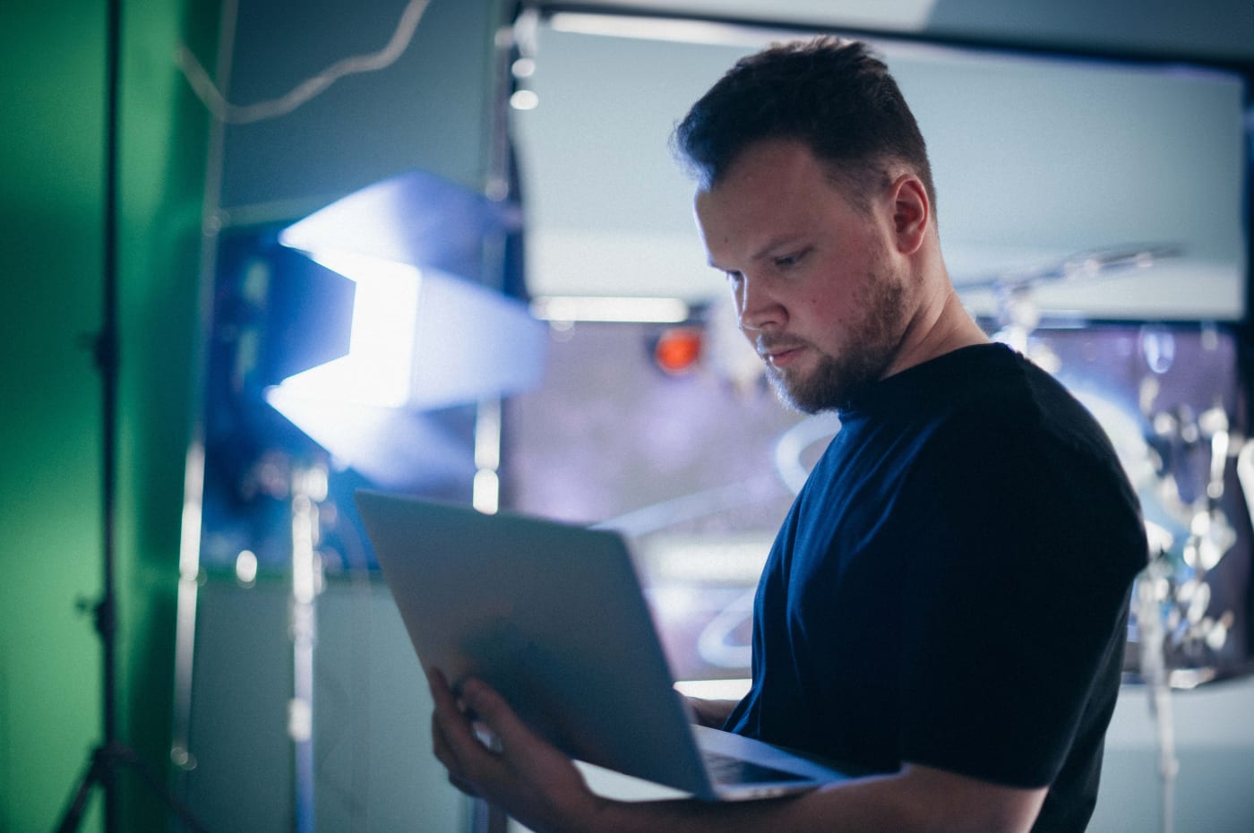 Video Tech on set working on laptop