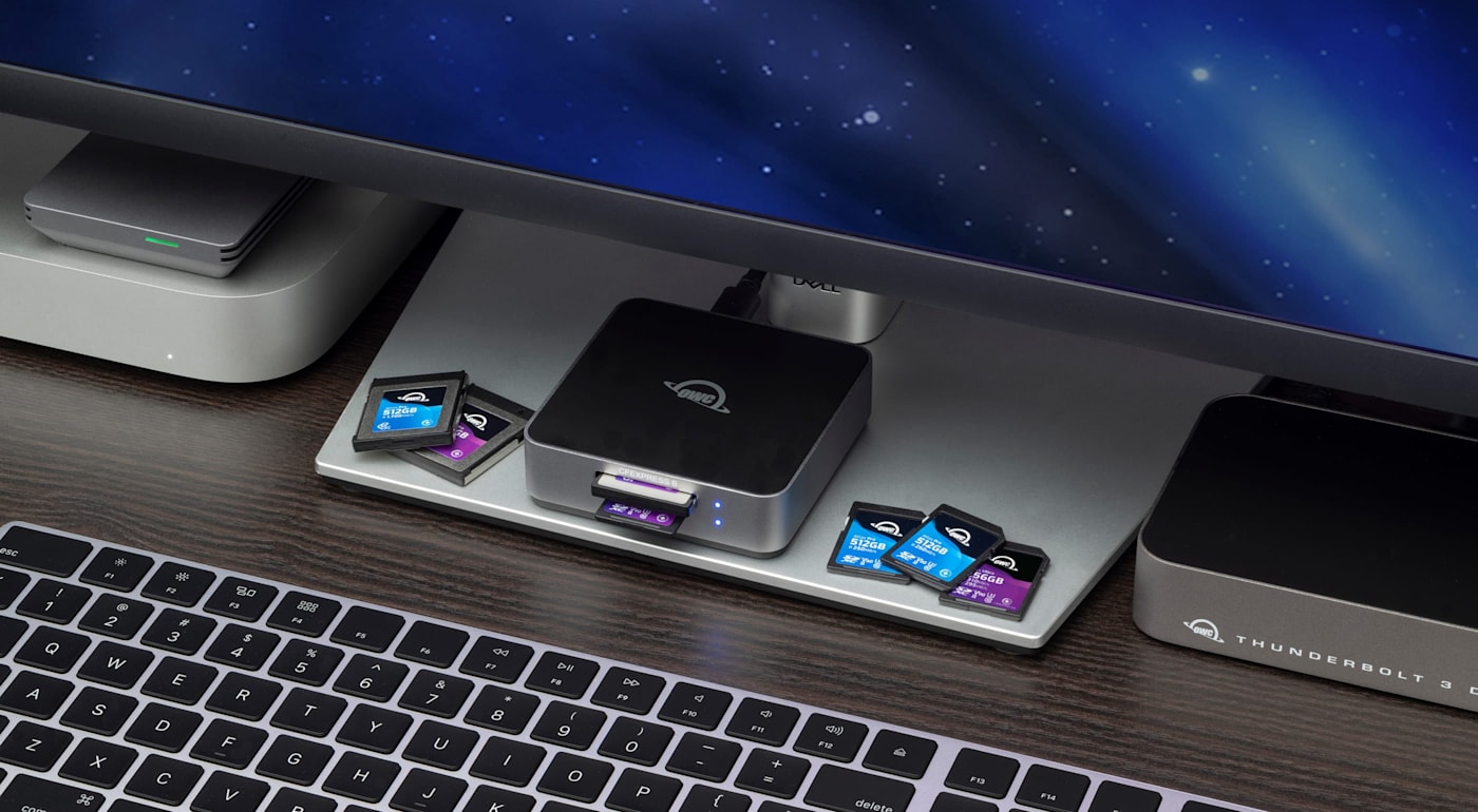 OWC Atlas Dual CFexpress + SD Card Reader on desktop with computer and media cards