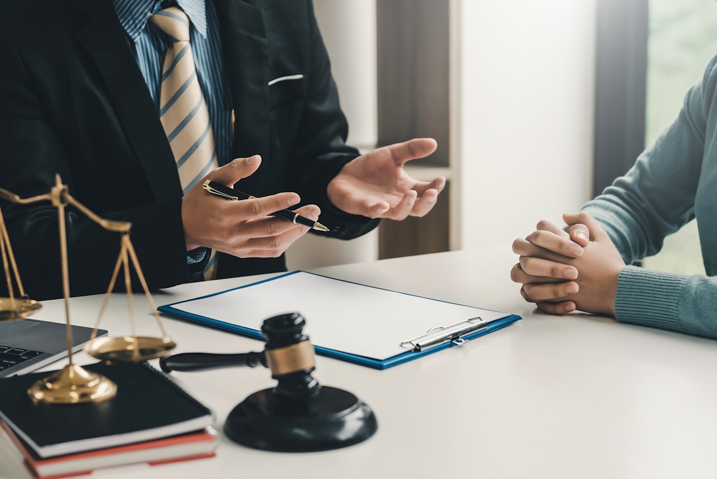 Closeup of two people discussing a legal matter