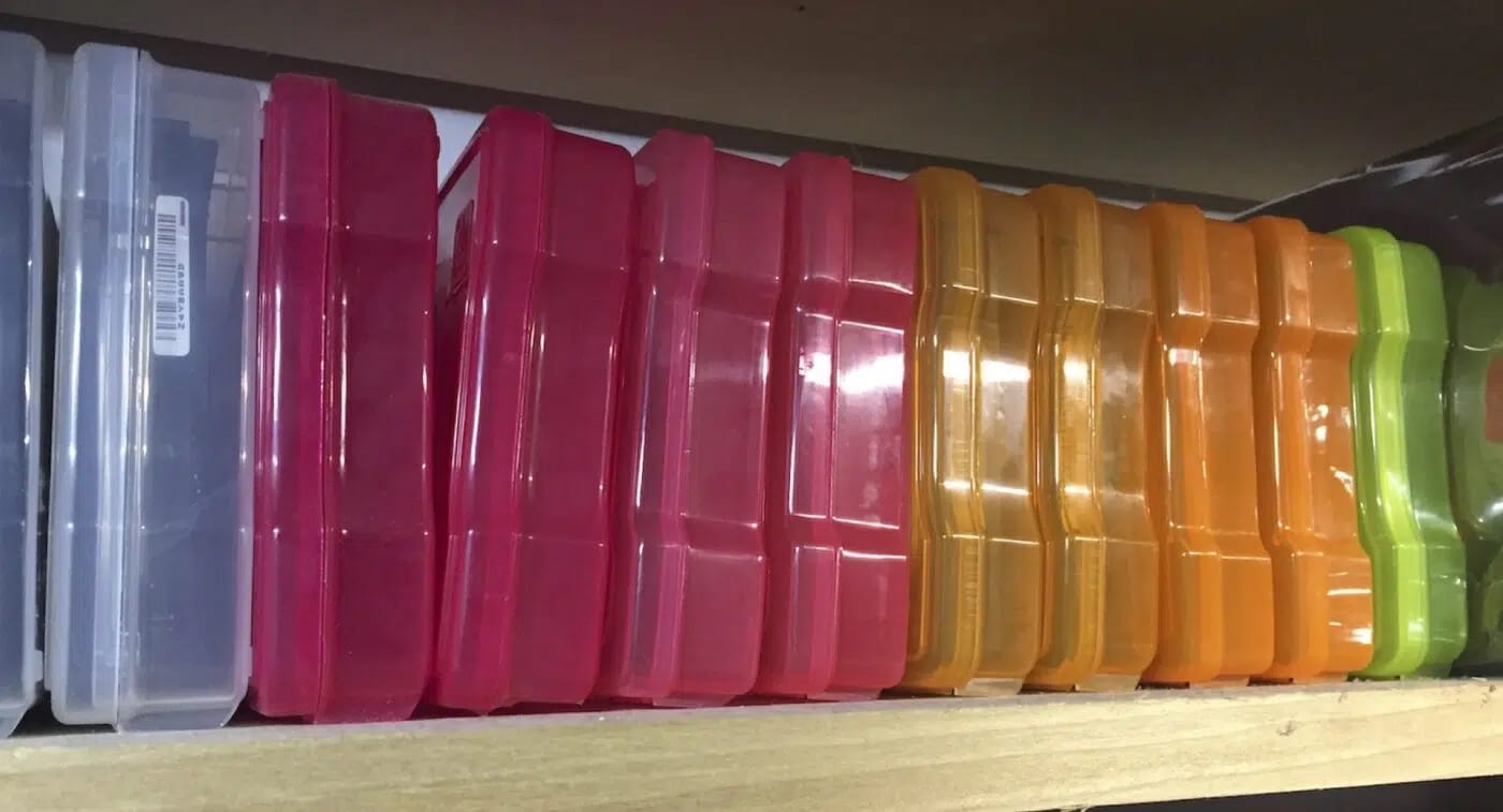 transparent colorful boxes on a shelf scaled
