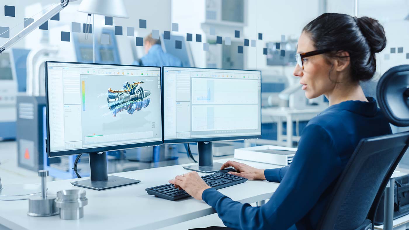 woman working with two monitors