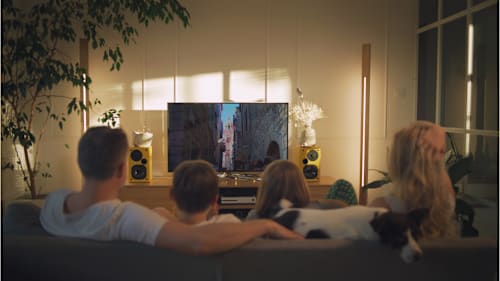 Family in front of TV entertainment center