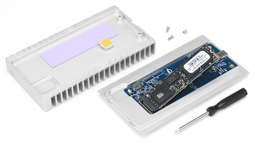 OWC Express 1M2 open with exposed SSD, Screwdriver, and Screws