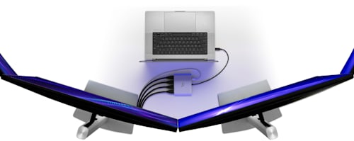 Overhead view of a MacBook Pro connected to an OWC USB-C Quad HDMI® 4K Display Adapter and four displays