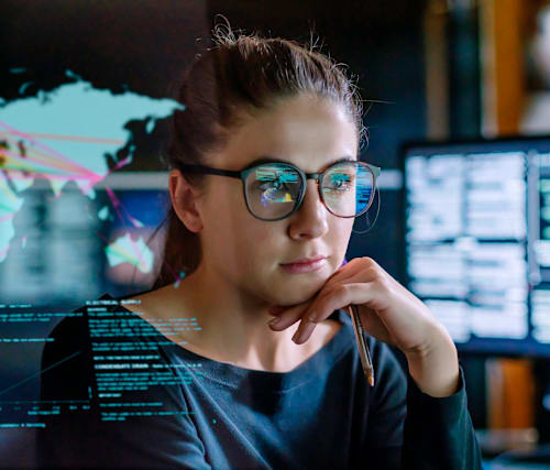 Woman in front of video screen