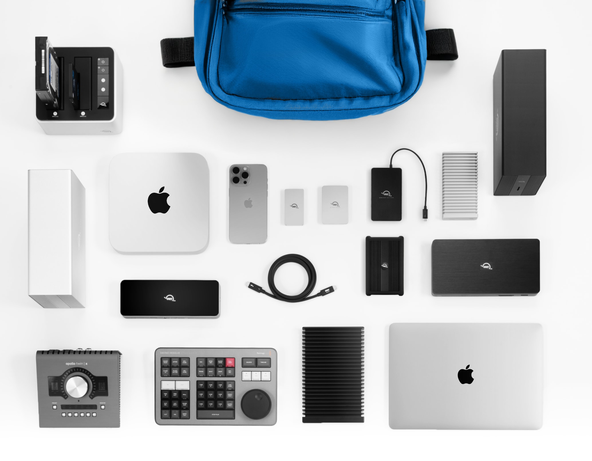A Blue Backpack surrounded by a mix of OWC and Apple Devices