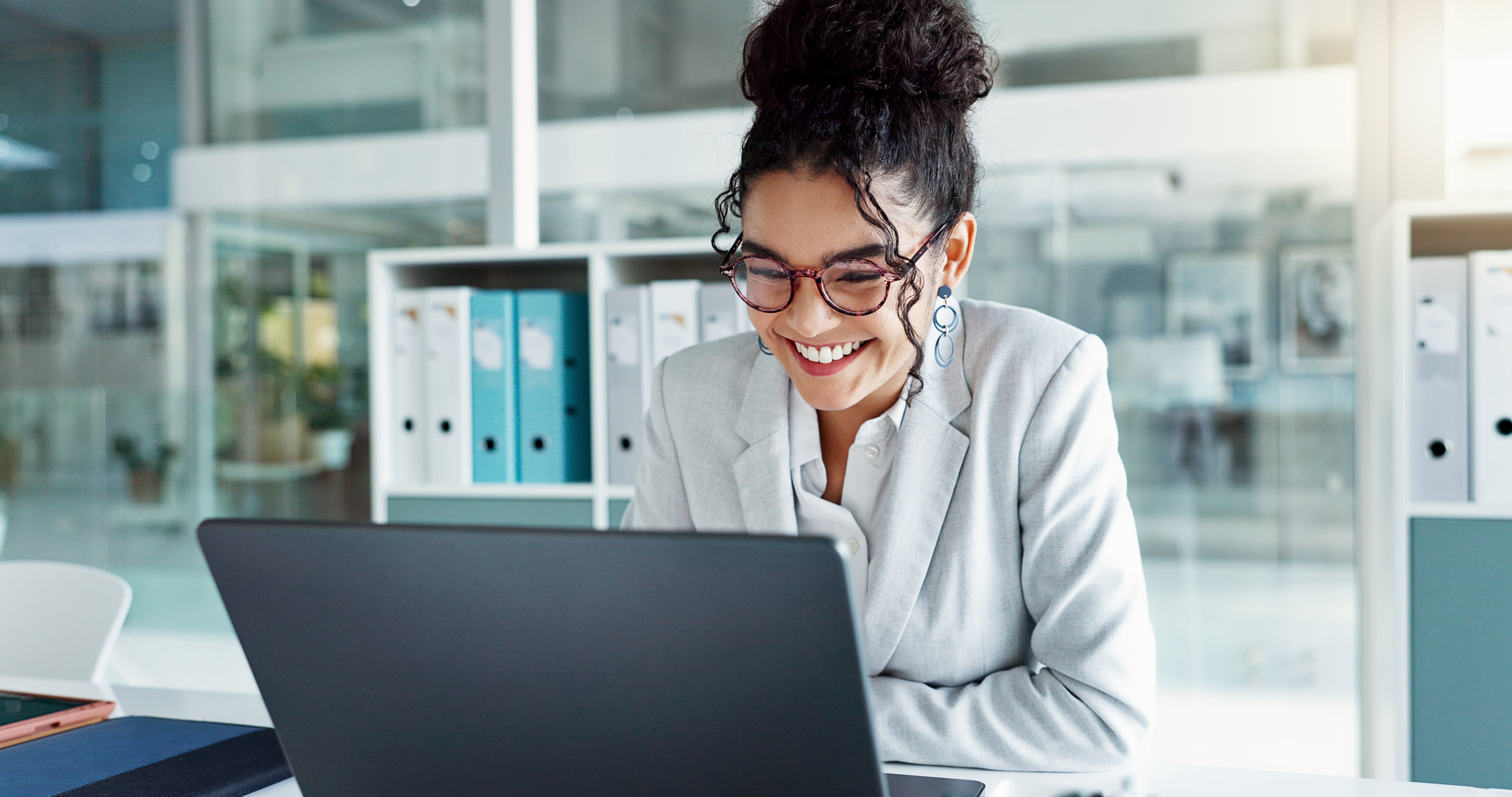 Woman working at laptop in conference room
