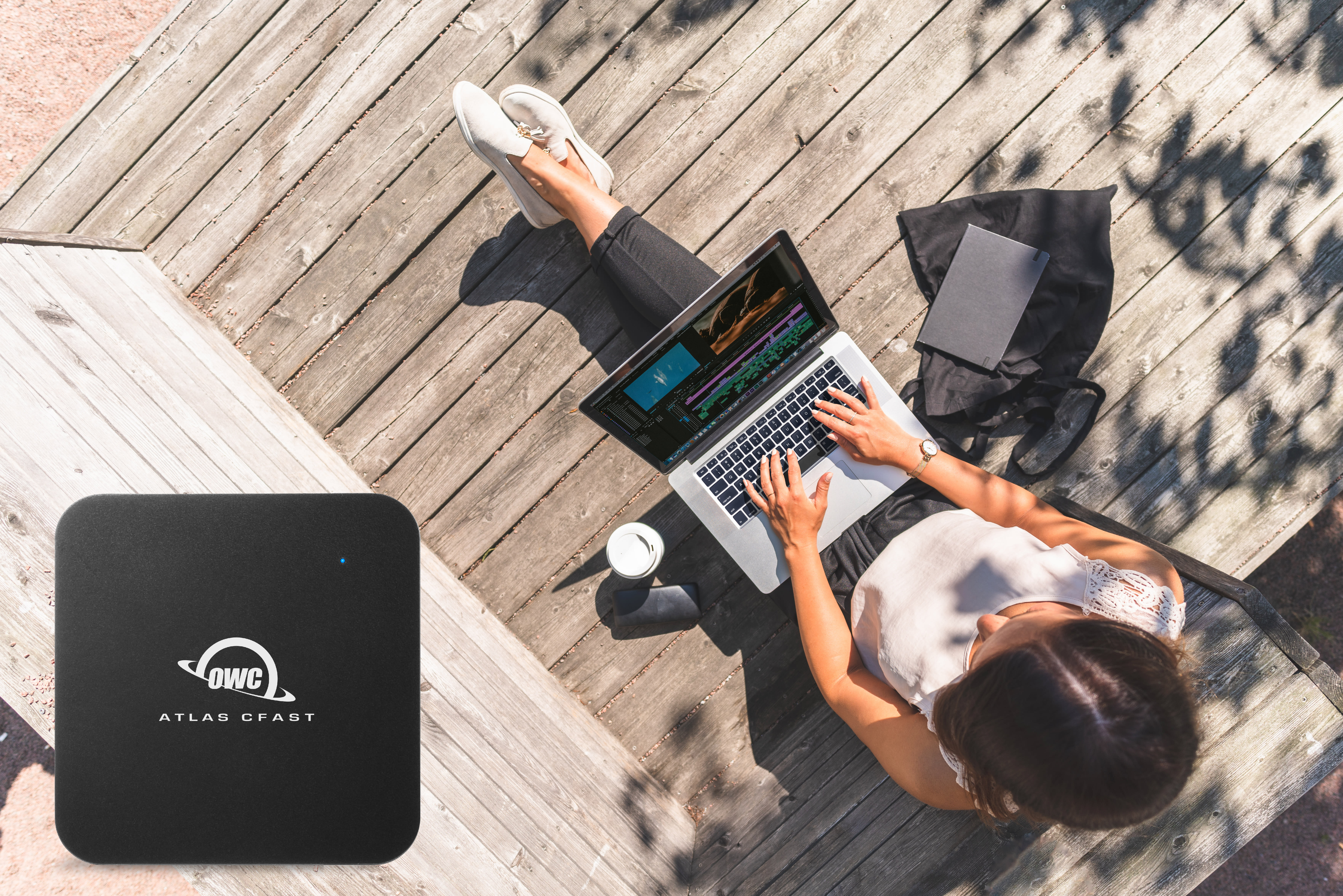 Woman working outdoors on laptop