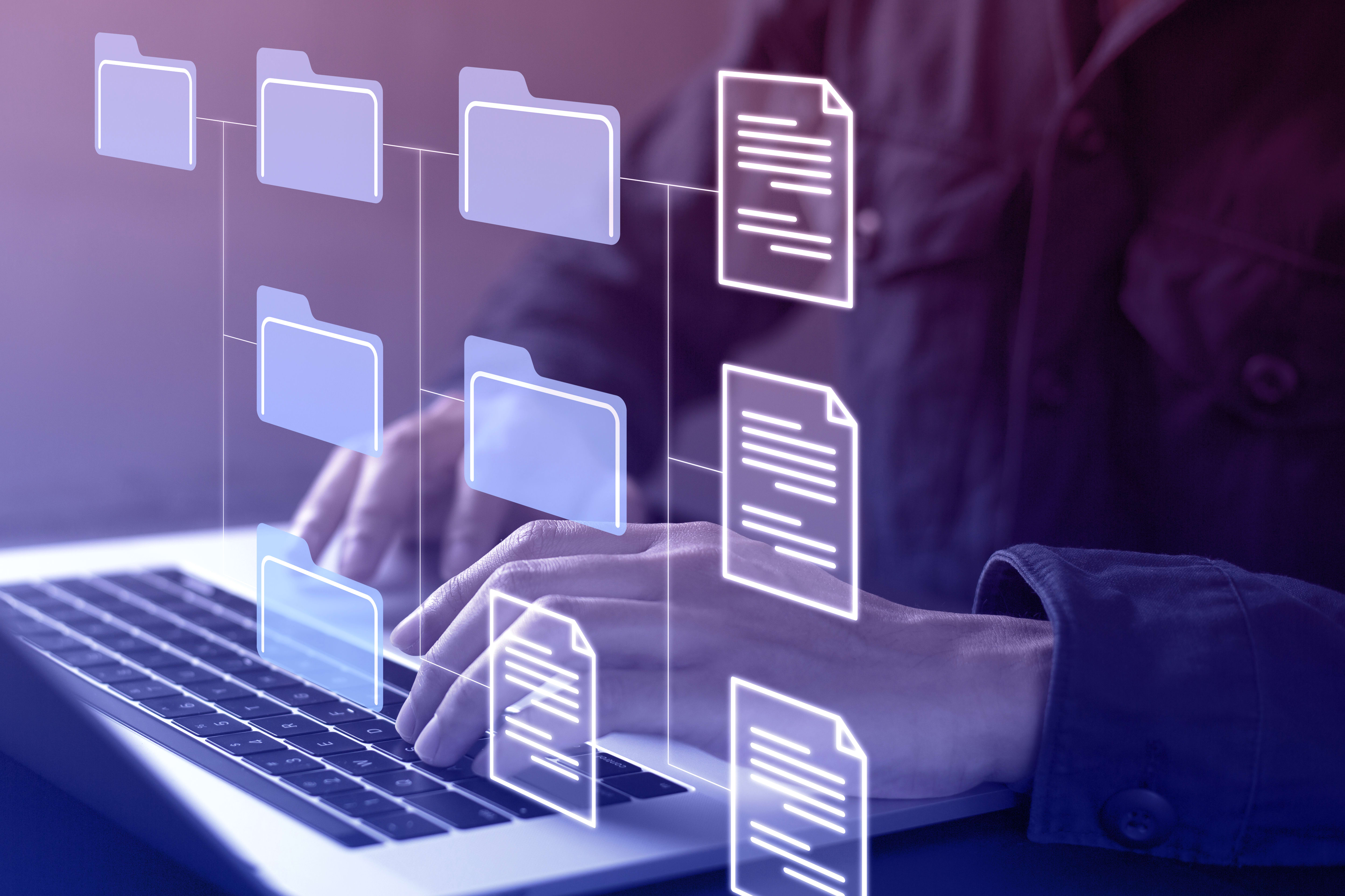 User operating a laptop with visual depiction file structure