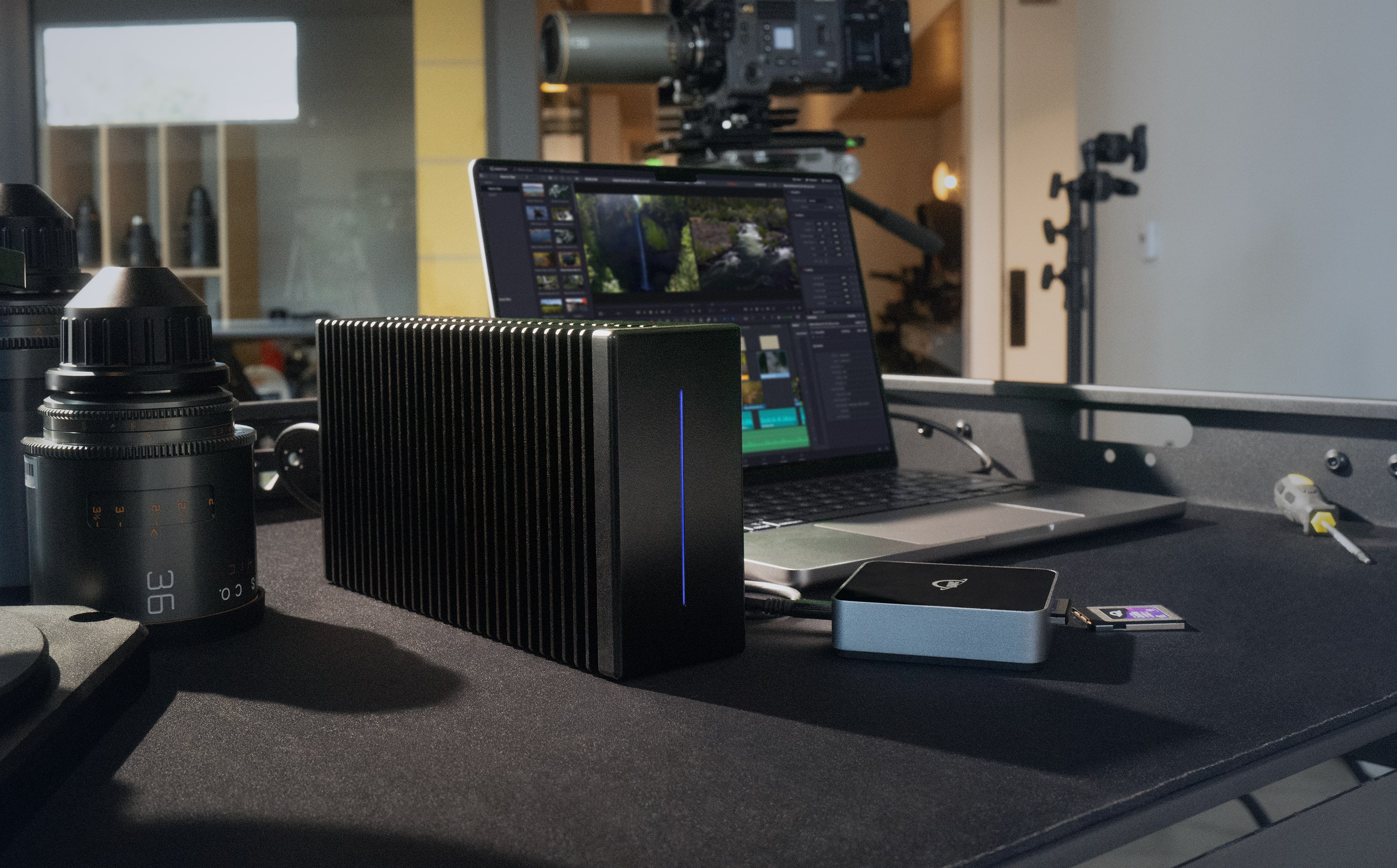 OWC ThunderBlade X12 on a desk next to a MacBook Pro