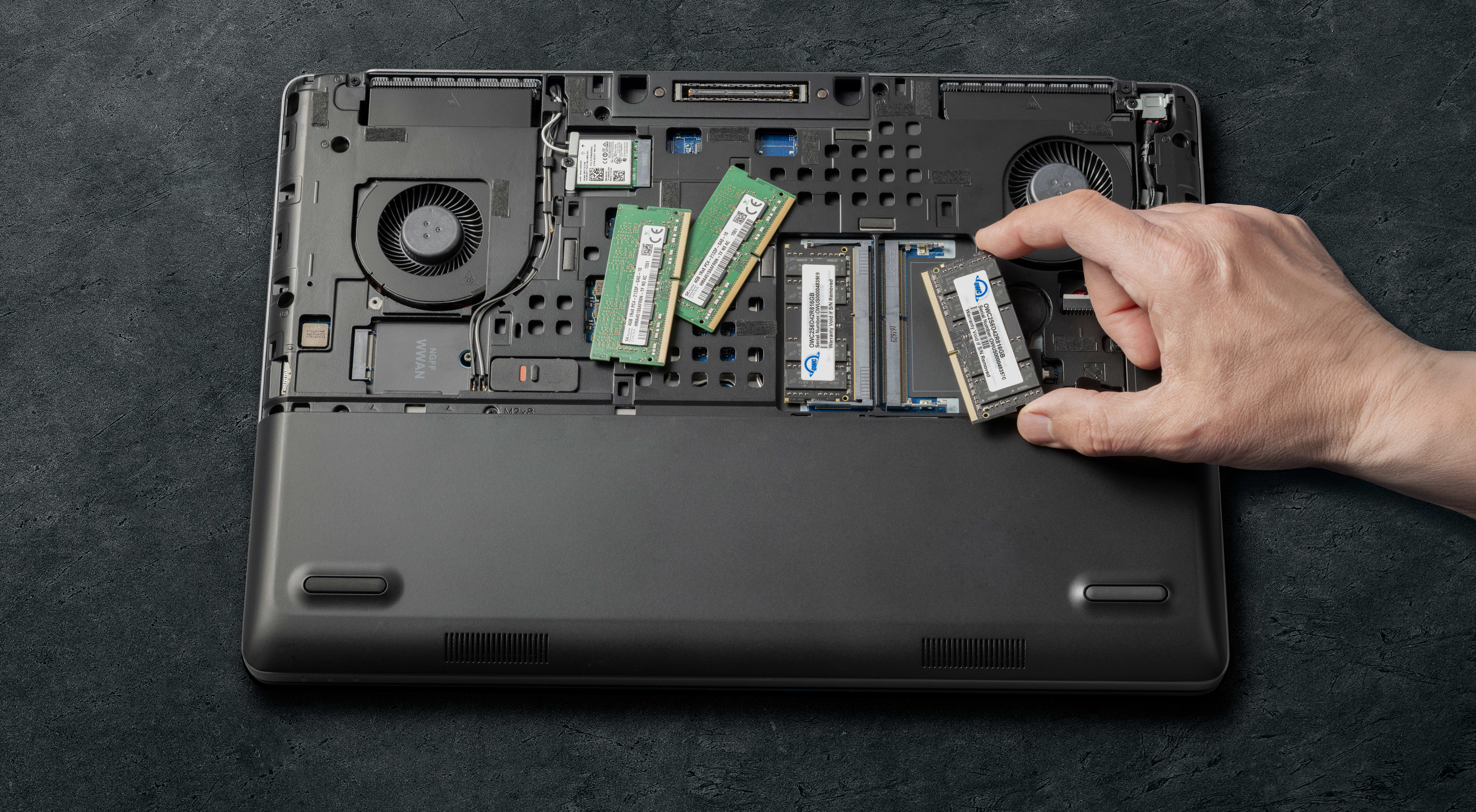 Laptop with back cover removed to show RAM